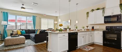 Townhome, 4 Bedrooms | Private kitchen | Full-size fridge, microwave, oven, stovetop