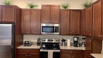 Townhome, 4 Bedrooms | Full-sized fridge, microwave, oven, stovetop