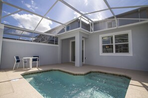 Outdoor pool, pool loungers, lifeguards on site