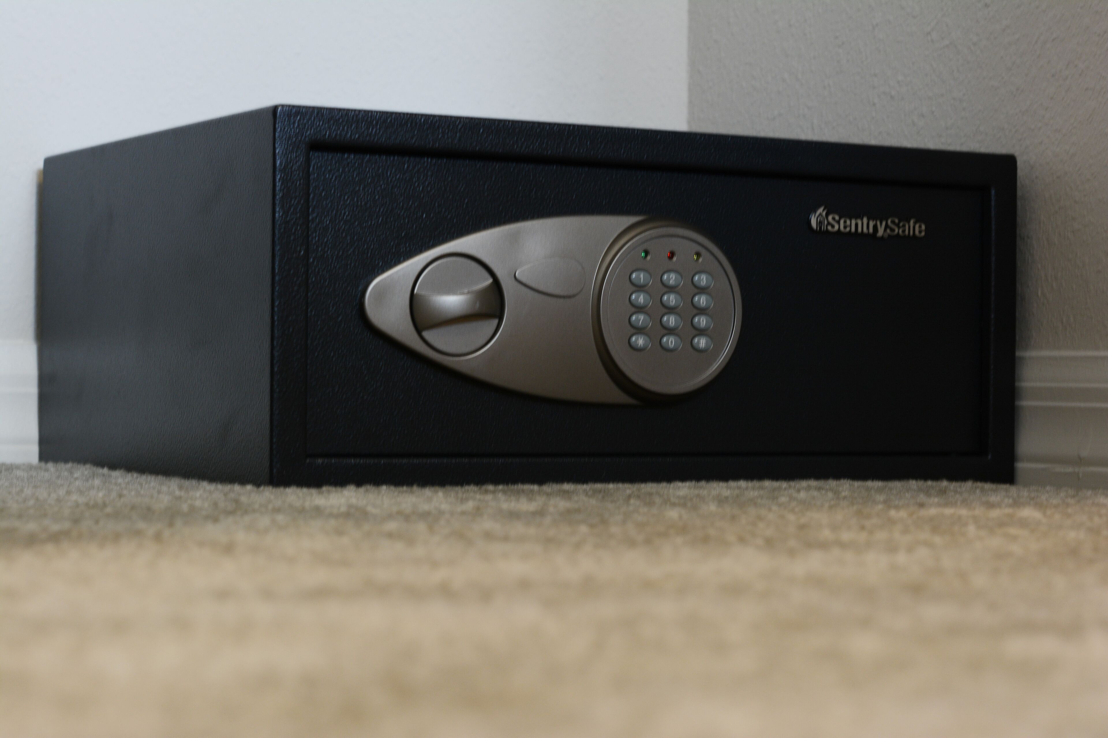 A black safe with a keypad and a keyhole, labeled "SentrySafe."