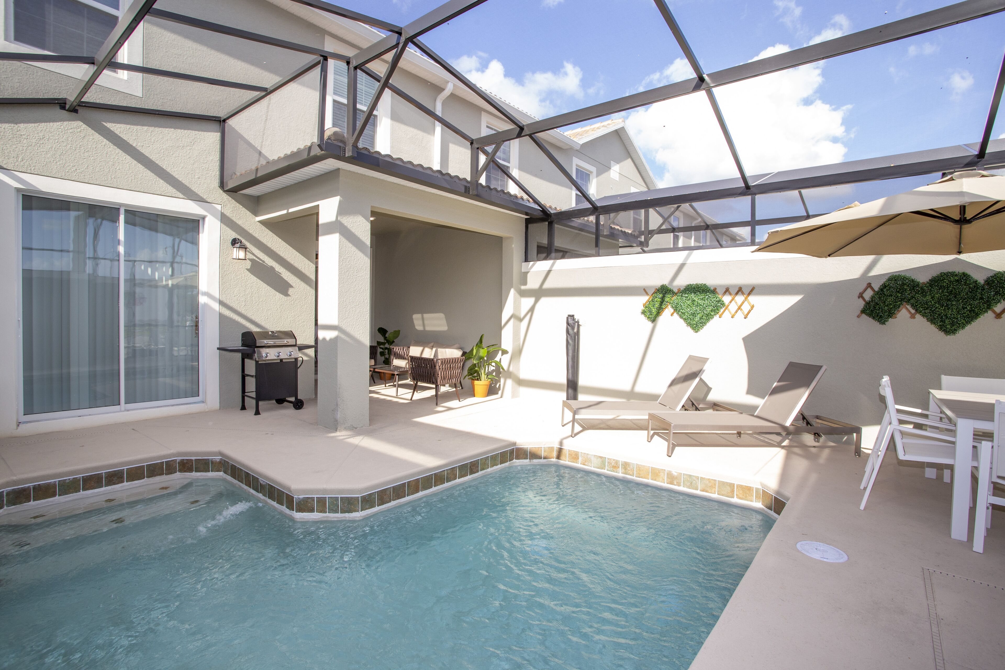 Outdoor pool, pool loungers, lifeguards on site