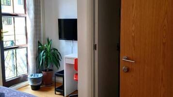 Desk, laptop workspace, blackout curtains, iron/ironing board