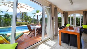 A spacious balcony with a pool, dining area, and outdoor seating. - Stunning private villa for 6 guests with A/C, private pool, WIFI, TV, terrace and pets allowed (Calpe)
