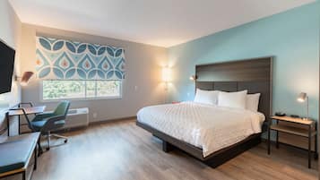 Hypo-allergenic bedding, desk, laptop workspace, blackout drapes