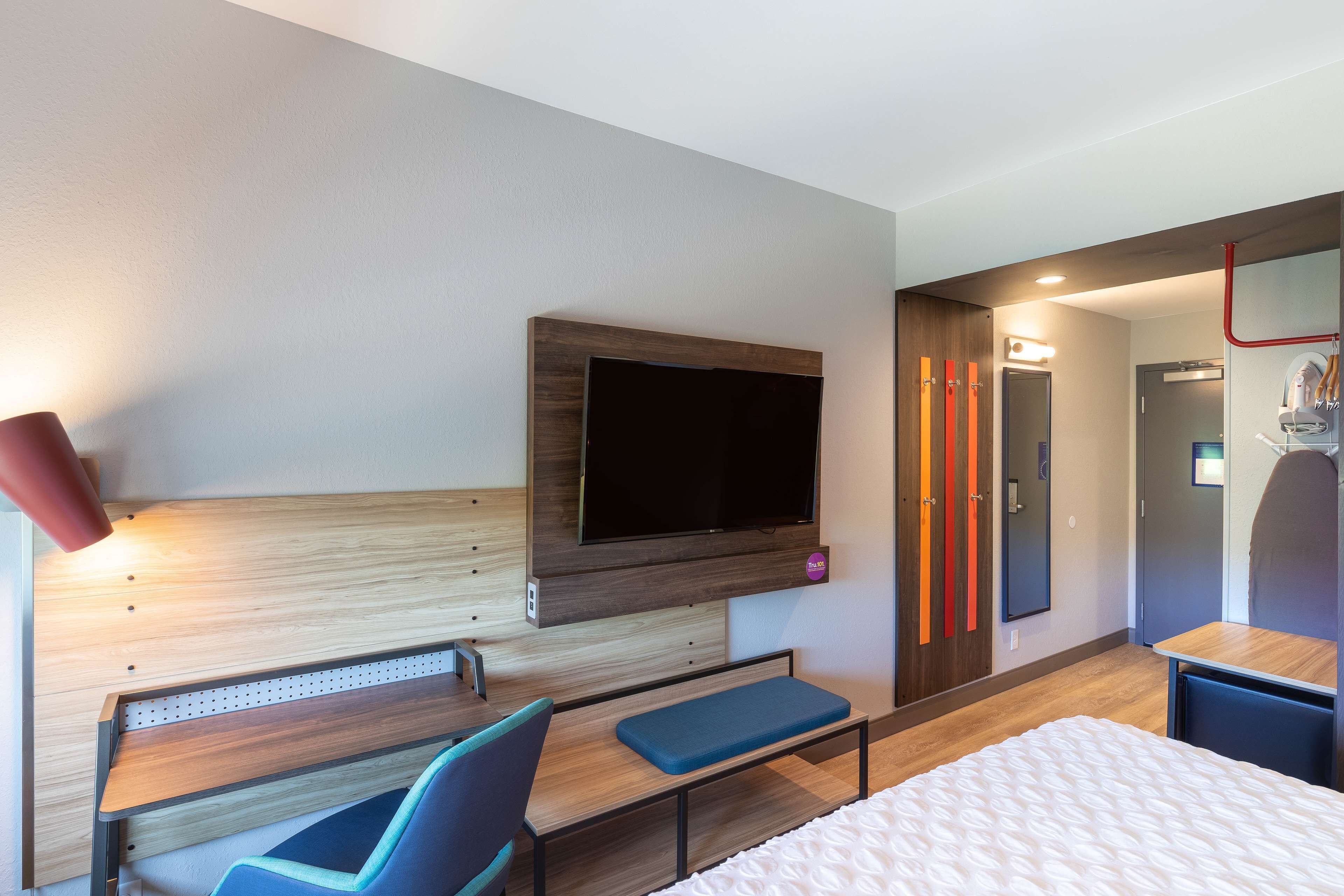 hypo-allergenic bedding, desk, laptop workspace, blackout curtains