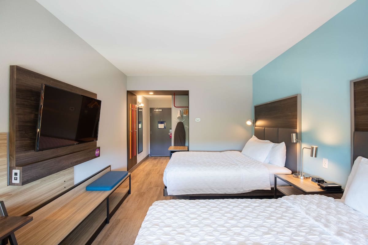 hypo-allergenic bedding, desk, laptop workspace, blackout curtains