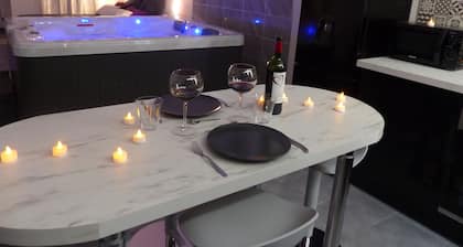 Appartement cosy avec Jacuzzi privatif pour une nuit romantique