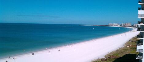On the beach, sun loungers, beach towels