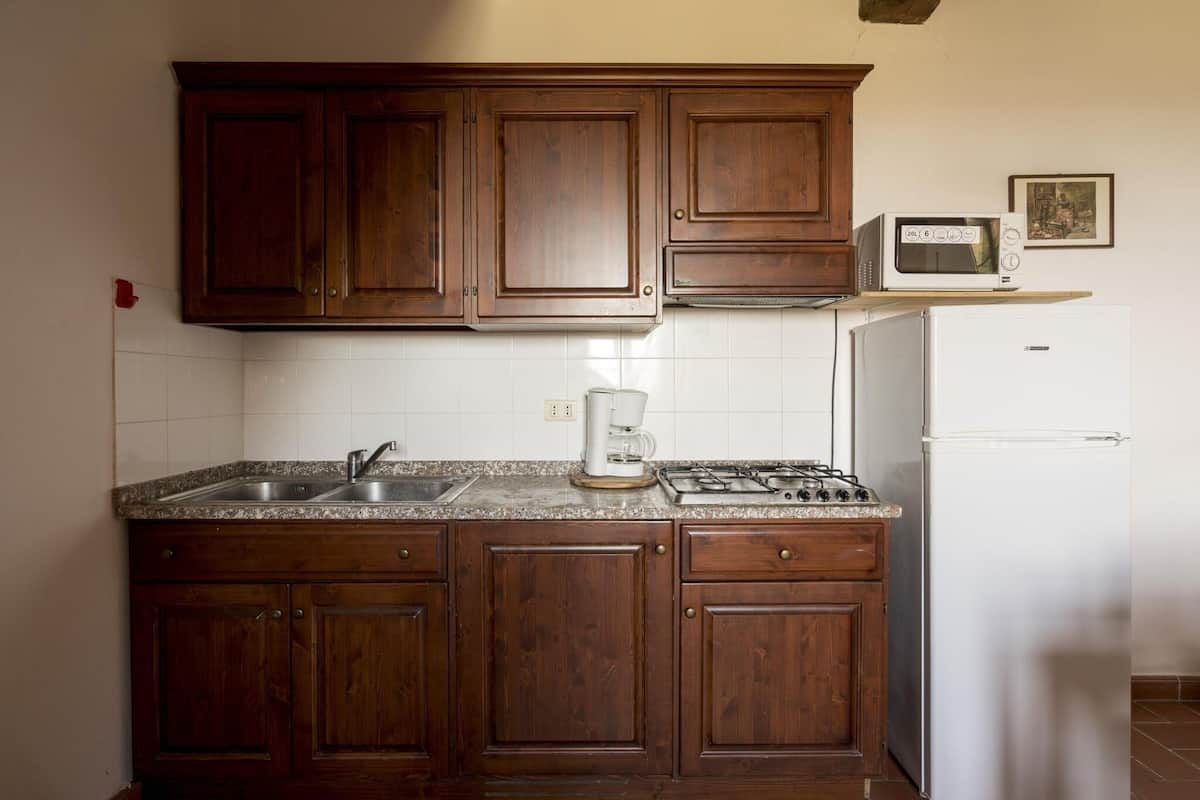 Casa | Cocina privada | Cafetera de espresso, refrigerador y periquera