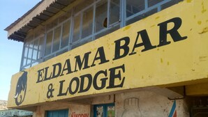A building with a sign reading "Eldama Bar & Lodge". - Eldama Lodge (Gilgil)