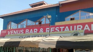 A building with a sign for 'VENUS BAR & RESTAURANT' and 'CLUB VENUS'. - Venus lodge Kikopeye (Gilgil)