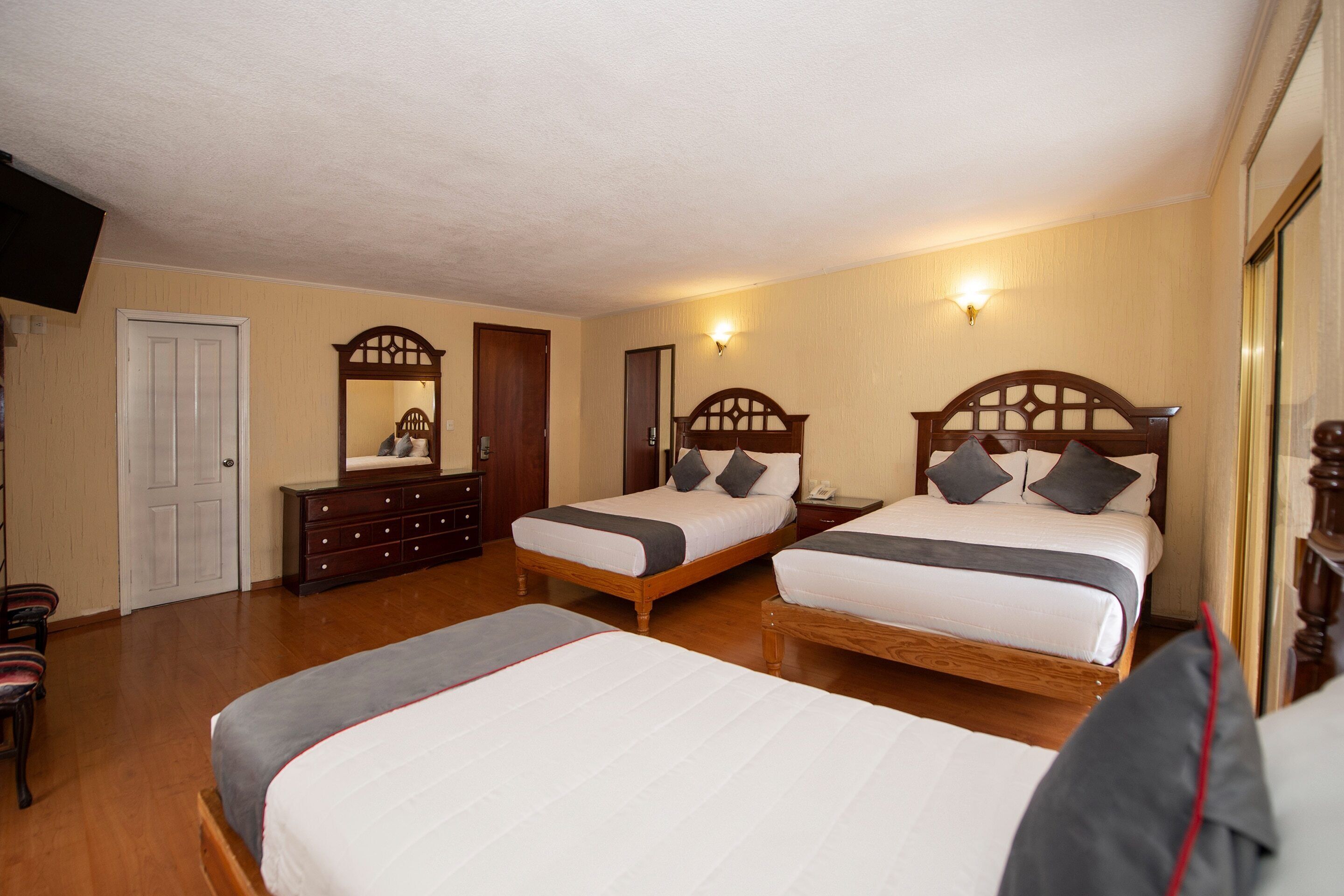 standard quadruple room (1 king) | 2 bedrooms, down duvets, in-room safe, iron/ironing board