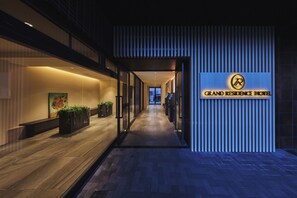 A hotel corridor with a sign for 'Grand Residence Hotel' and a view of the interior. - Grand Residence Hotel Tenjin (Fukuoka)