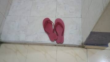 Shower, rainfall showerhead, slippers, towels