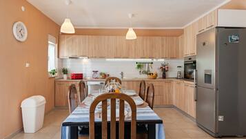 Villa | Private kitchen | Stovetop, electric kettle, toaster, high chair