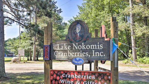 A sign for Lake Nokomis Cranberries, Inc. with a logo and a sign for Ocean Spray. - Simple Cranberry & Wine Farm Home w/ Fire Pit! (Eagle River)
