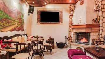 Villa | Living room | TV, fireplace