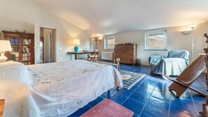 A bedroom with a bed, a wooden dresser, a chair, a desk, and a bookshelf. - Vintage Holiday Home in Caselle in Pittari near Forest (Caselle in Pittari)