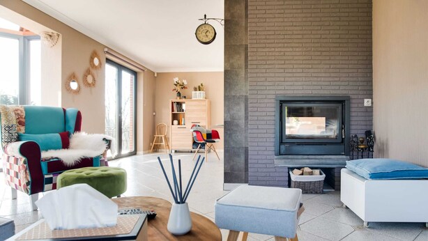 A modern living room with a fireplace, a sofa, a coffee table, and a TV. - Luxurious Villa in Durbuy With Swimming Pool (Durbuy)