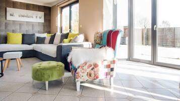 Villa | Living area | TV, fireplace