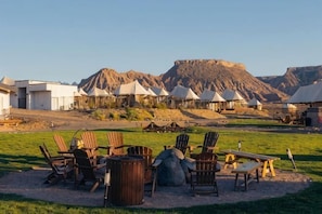 A desert resort with tents, outdoor seating, and a mountain backdrop. - Zion Wildflower, BW Premier Collection (Virgin)