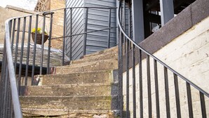 A staircase with stone steps and metal railings leading to a wooden deck. - Sandgate 2-bed Apartment in Ayr Central Location (Ayr)