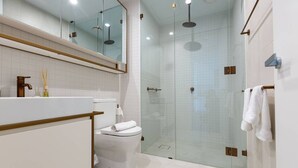A modern bathroom with a glass-enclosed shower, a white toilet, and a vanity with a mirror. - Perfect Location 2 Bdrs Apartment@glen Waverley (Glen Waverley)