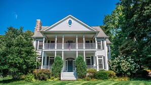 A two-story house with a balcony, a front porch, and a chimney. - Large Luxury Family Home Near Five Colleges. The TOP short term rental in area! (Hadley)