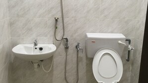 A bathroom with a sink, toilet, and shower. - Homey Hostel, Ipoh Town (Ipoh)