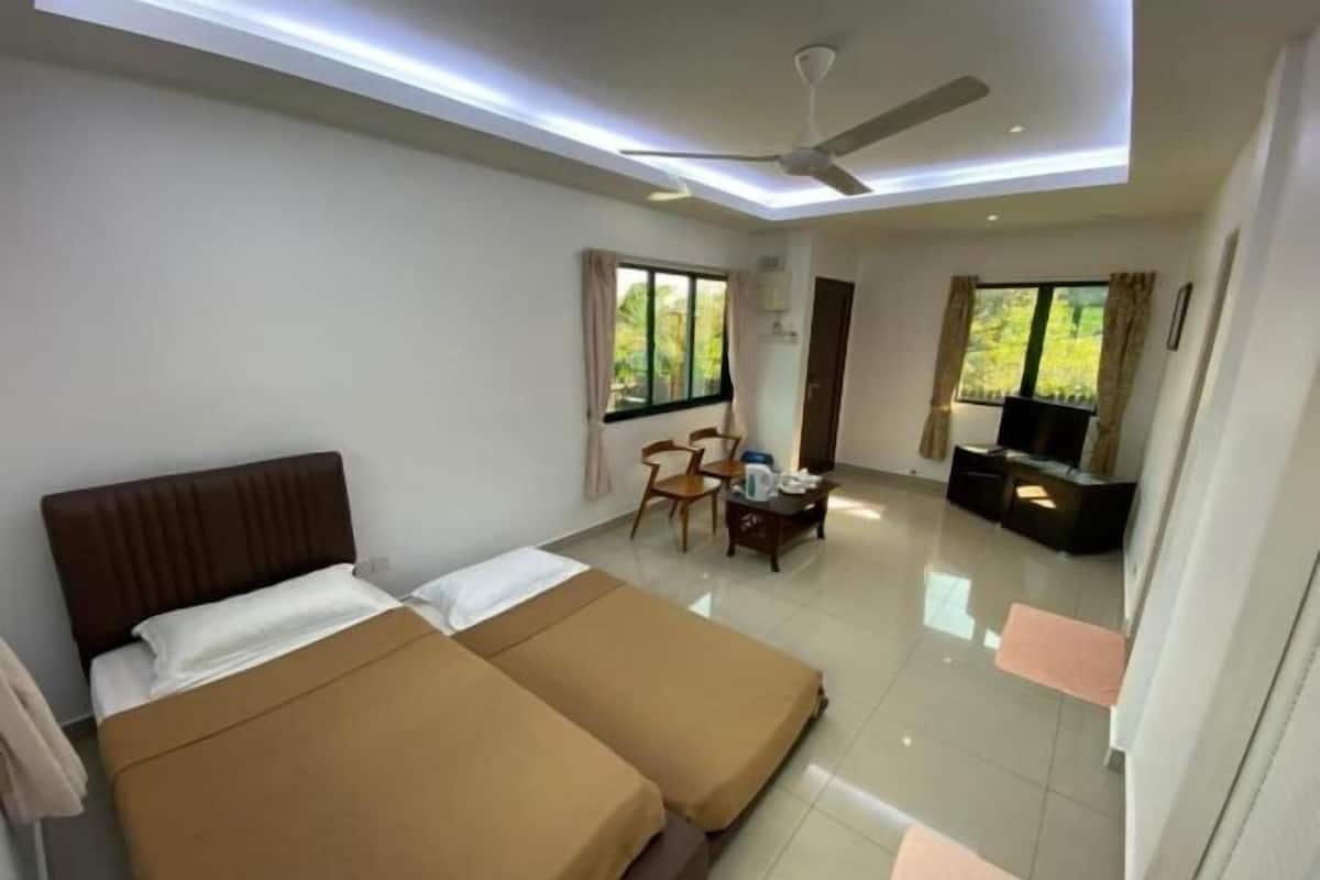 Desk, iron/ironing board, bed sheets