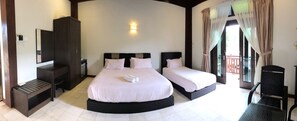 A hotel room with two beds, a wardrobe, a desk, and a chair. - Singgahsana Villa by Zuzu (Langkawi)