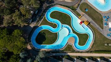 Seasonal outdoor pool, open 10:00 AM to 6:00 PM, pool umbrellas