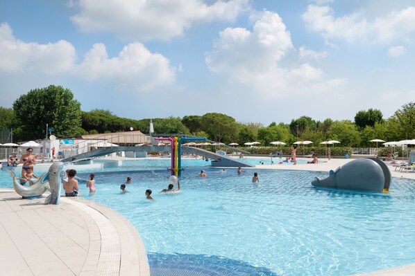 Seasonal outdoor pool, open 10:00 AM to 6:30 PM, pool umbrellas