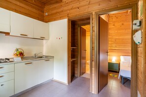 Comfort Chalet, 1 Bedroom (Pet Friendly) | Private kitchen | Full-size fridge, microwave, stovetop, cookware/dishes/utensils