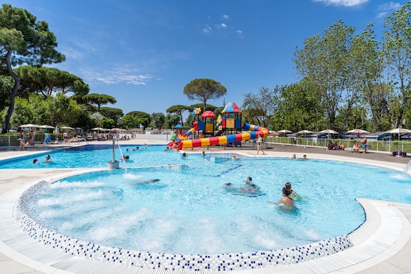 Seasonal outdoor pool, open 10:00 AM to 6:00 PM, pool umbrellas