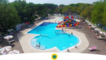 Seasonal outdoor pool, open 10:00 AM to 6:00 PM, pool umbrellas