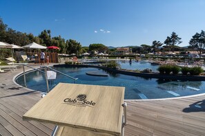 Seasonal outdoor pool, open 9:30 AM to 7:00 PM, pool umbrellas