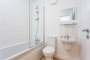 Bathtub, hair dryer, towels