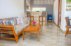 Chambre Confort | Coin séjour