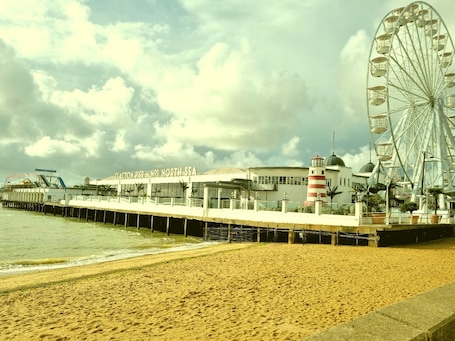 On the beach. OYO Pier Hotel