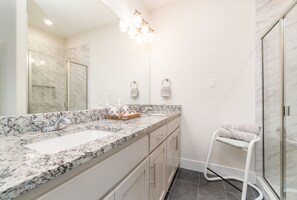 Combined shower/bathtub, towels, soap, shampoo