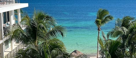 On the beach, sun loungers, beach towels