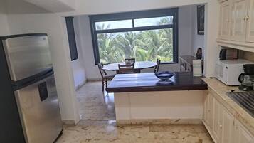 Fridge, microwave, stovetop, coffee/tea maker