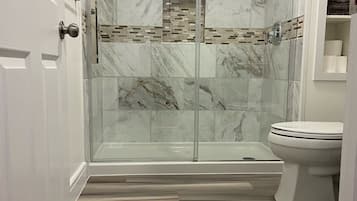Combined shower/tub, hair dryer, towels, soap