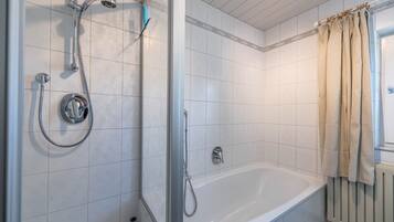 Bathtub, hair dryer, towels