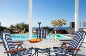 A heated pool, pool loungers