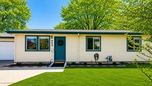 A single-story house with a front door, two windows, and a mailbox. - Fenced Backyard | Near Mall & Hospitals (39) (Boise)