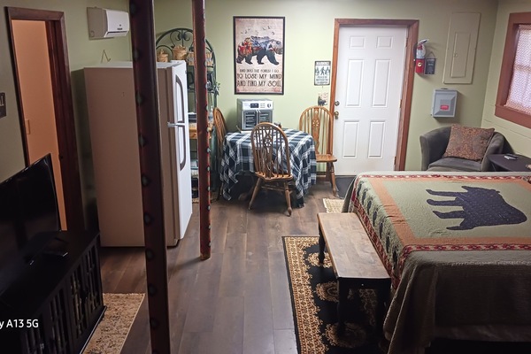 Yes, that is a Full size refrigerator. Fireplace on the other side of the bed.