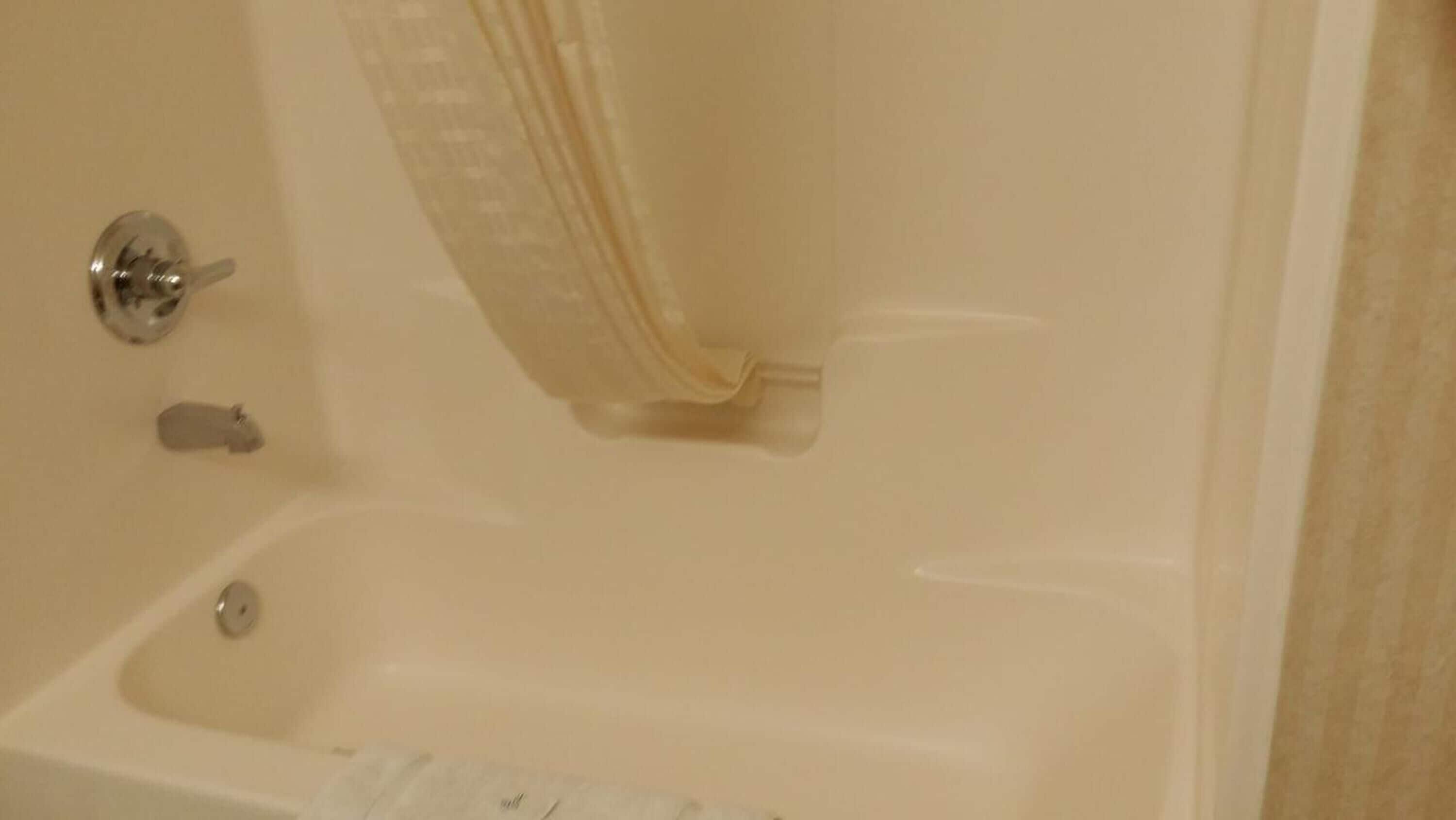 bathtub, free toiletries, towels, soap