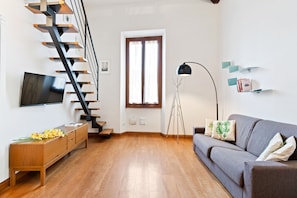 Departamento, 1 habitación | Área de sala de estar | Televisión de pantalla plana